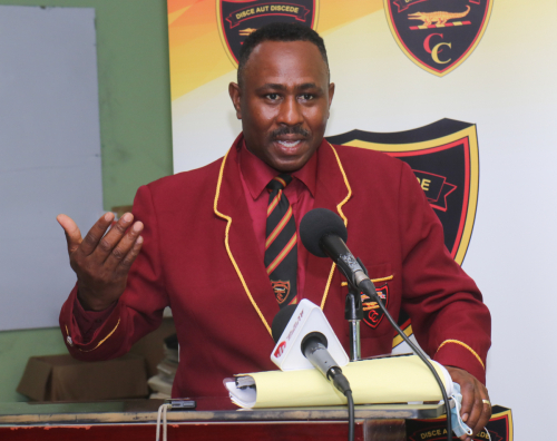 Dr. Richard Meghoo, president of the Montego Bay chapter of the Old Boys Association speaks to the small audience.